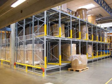 A pallet flow storage system with pallets stored on rollers.
