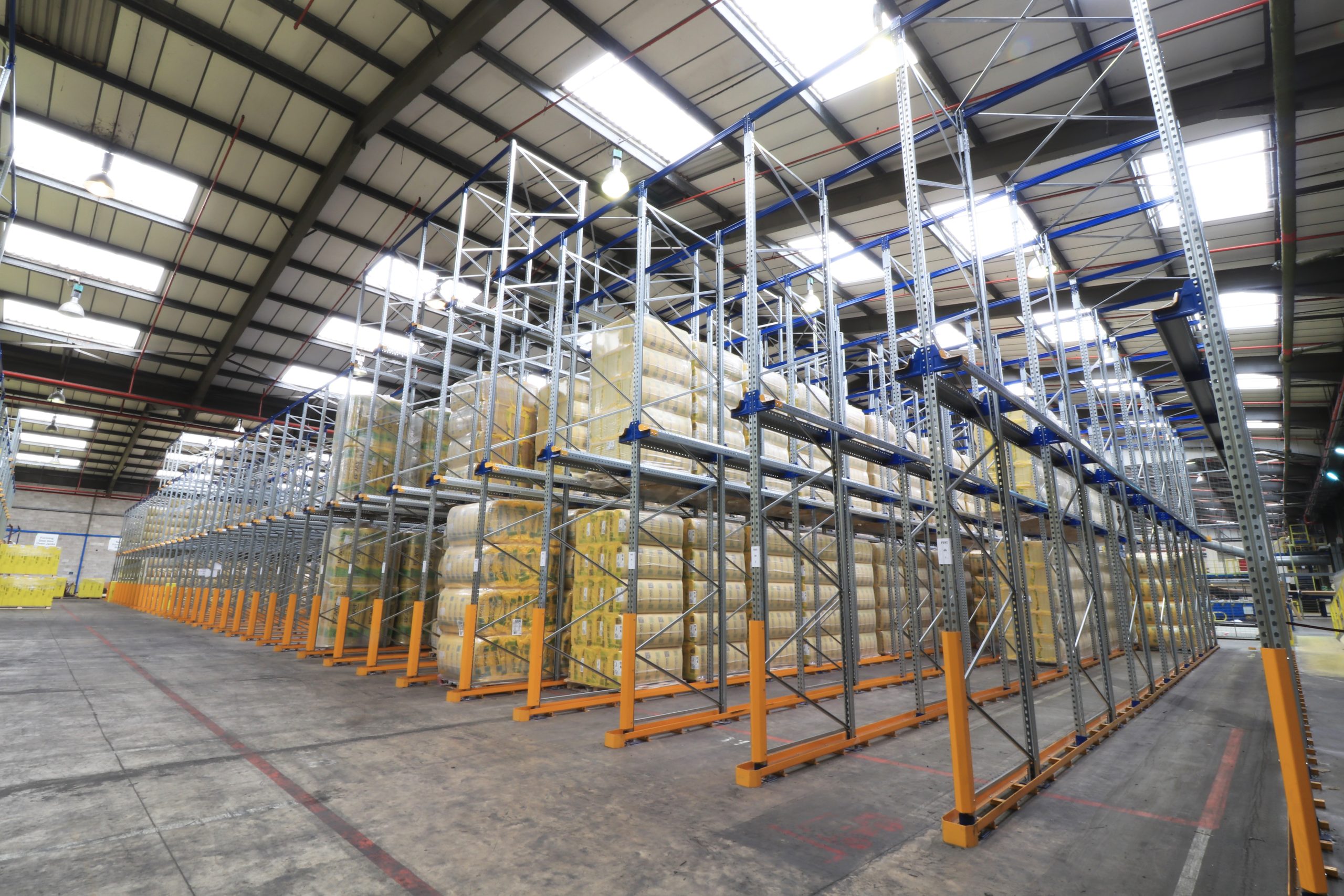 blue and galvanised drive in racking system within a warehouse
