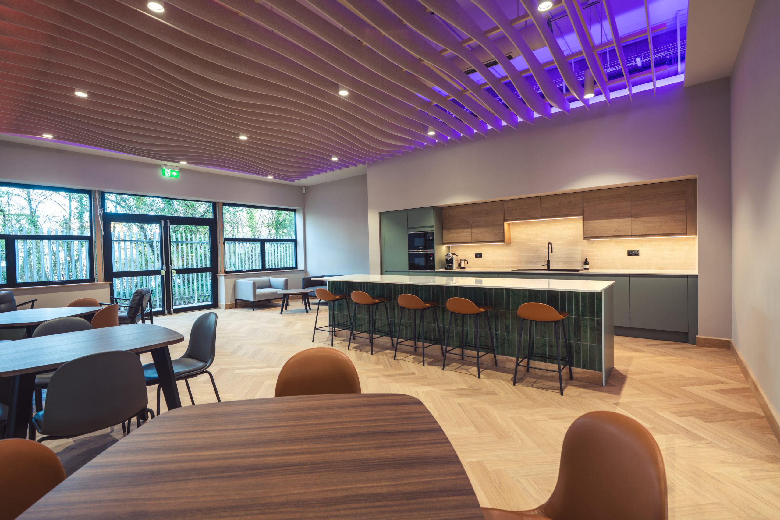 Acoustics can be controlled by ceiling and wall finishes as well as plants and soft furnishings