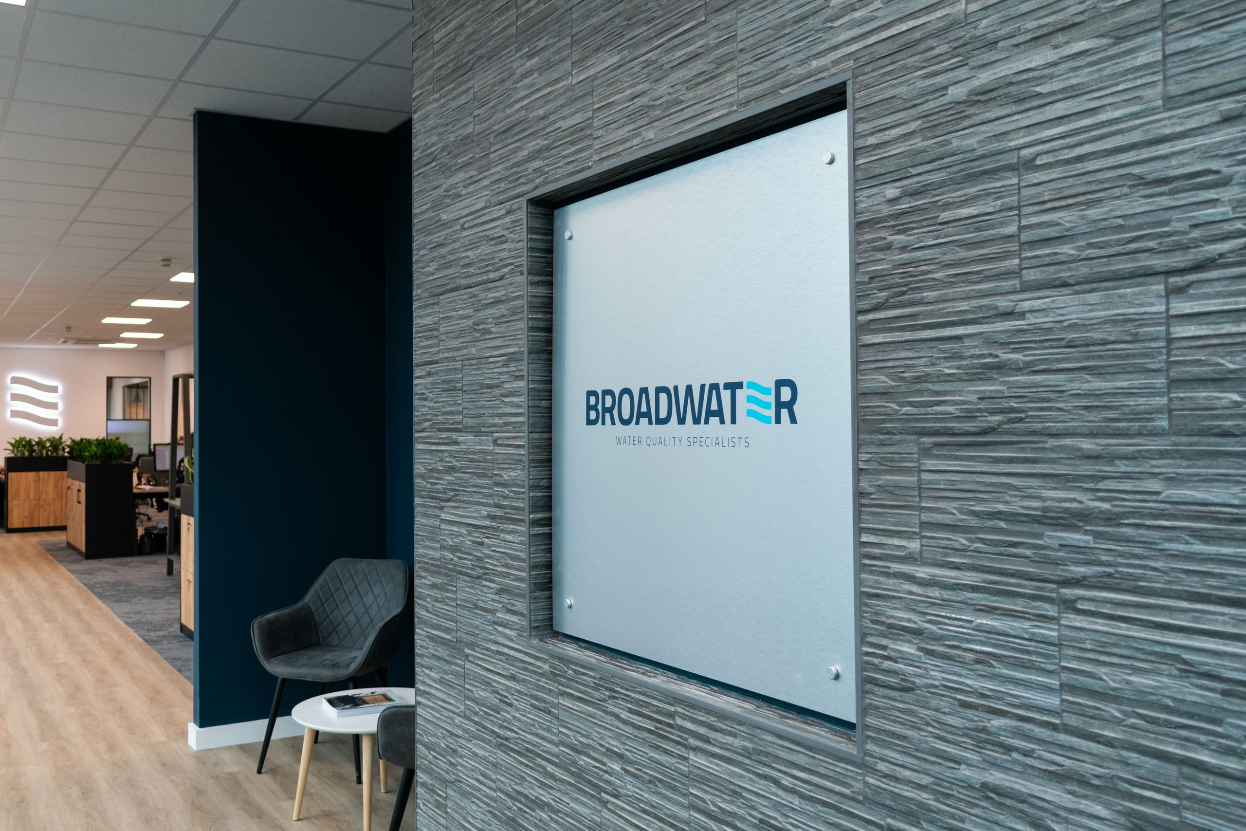 Office reception area with brand colours and planting
