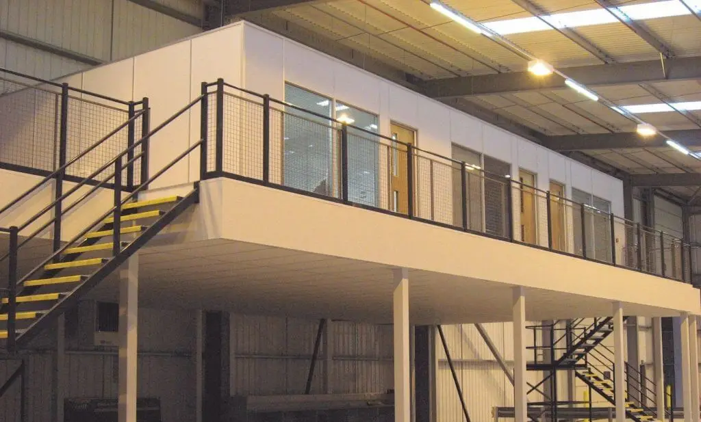 office space on a mezzanine floor above a warehouse operation below. 