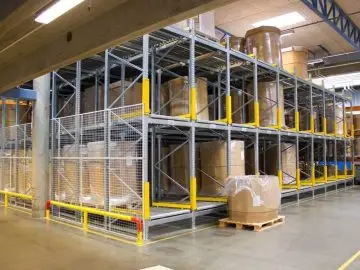 A pallet flow storage system with pallets stored on rollers.