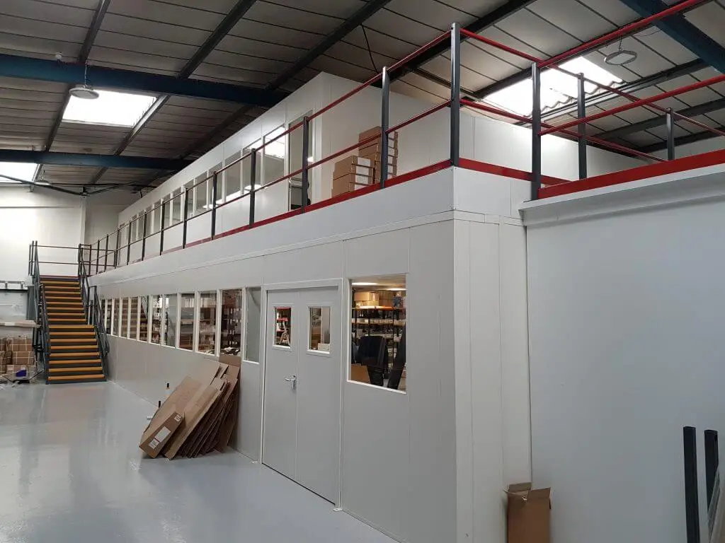 mezzanine floor with steel partitioning above and below for creating segregated workspaces