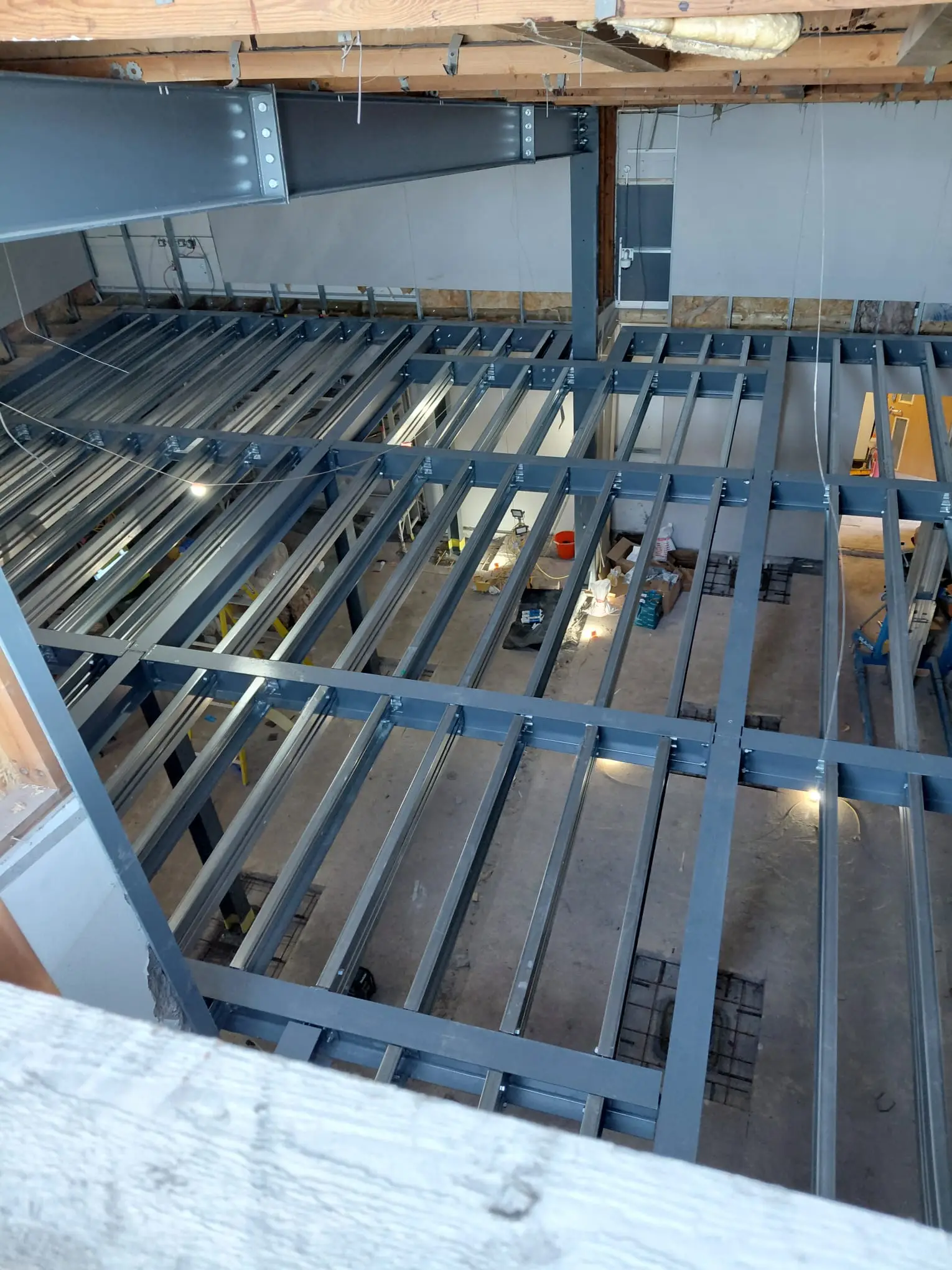 a commercial mezzanine was installed to make use of the height of the unused squash court