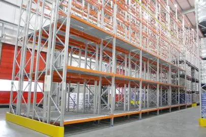Warehouse with empty push-back storage racks.